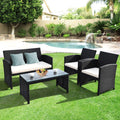 4 Pieces Rattan Patio Furniture Set with Weather Resistant Cushions and Tempered Glass Tabletop-Whi